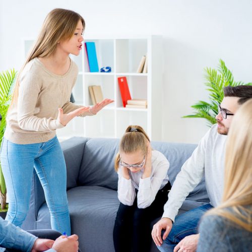 75203817 - couple arguing at therapy session in therapists office